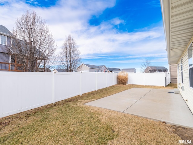 view of yard featuring a patio area and a fenced backyard