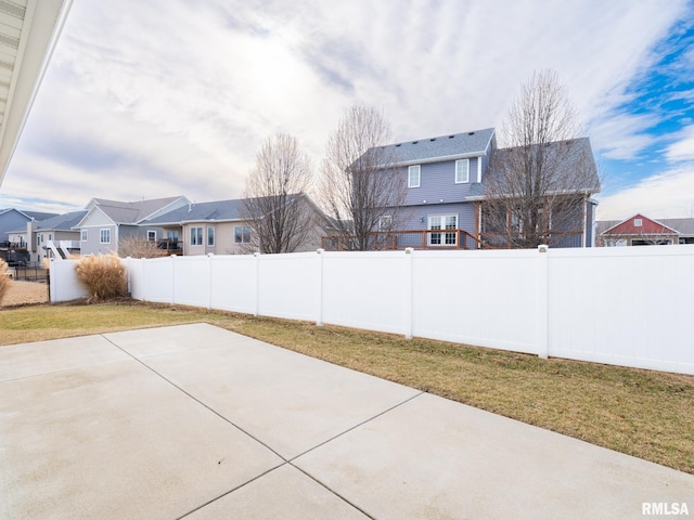 view of patio with a fenced backyard and a residential view