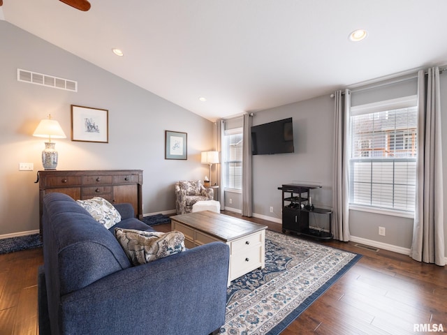 living room featuring dark wood-style floors, recessed lighting, visible vents, and vaulted ceiling