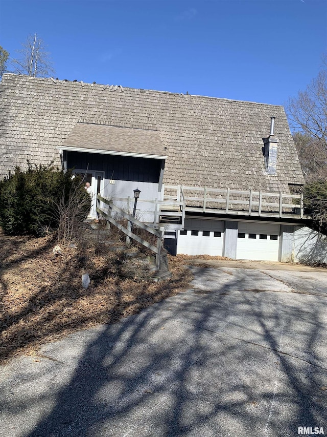 view of side of property with a garage