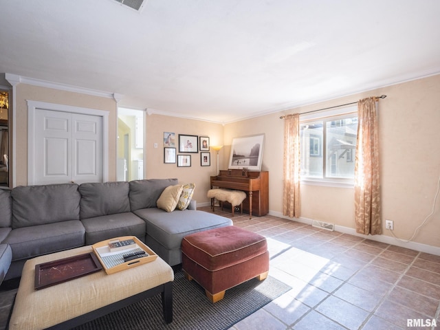 living area featuring ornamental molding, visible vents, baseboards, and light tile patterned flooring