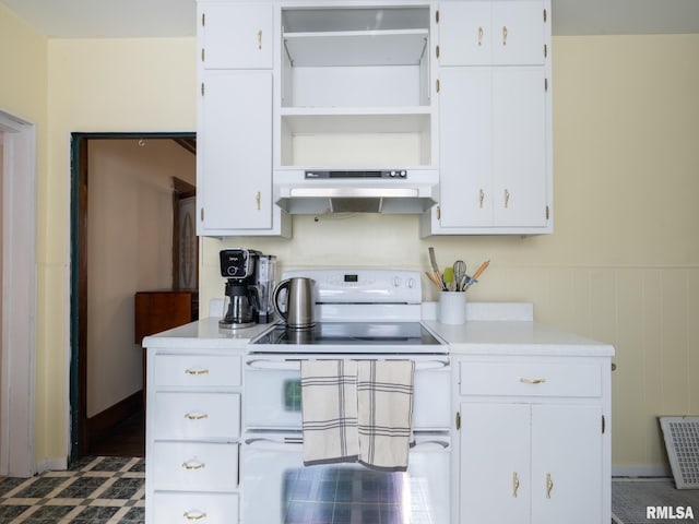 kitchen with white cabinets, light countertops, under cabinet range hood, double oven range, and open shelves