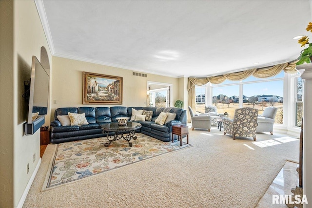 living room with carpet floors, baseboards, visible vents, and crown molding