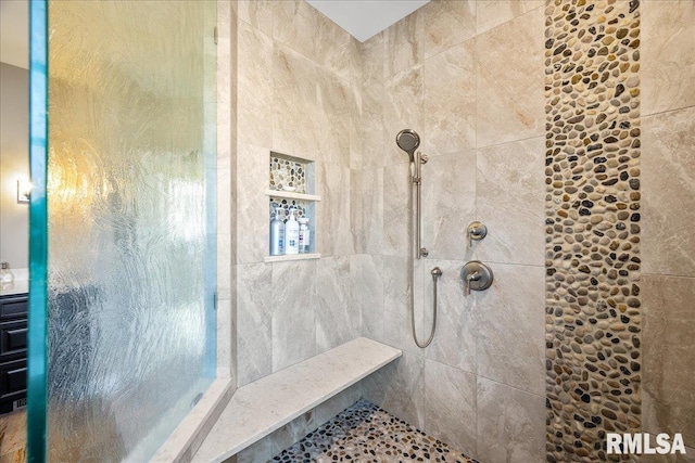 bathroom with a tile shower