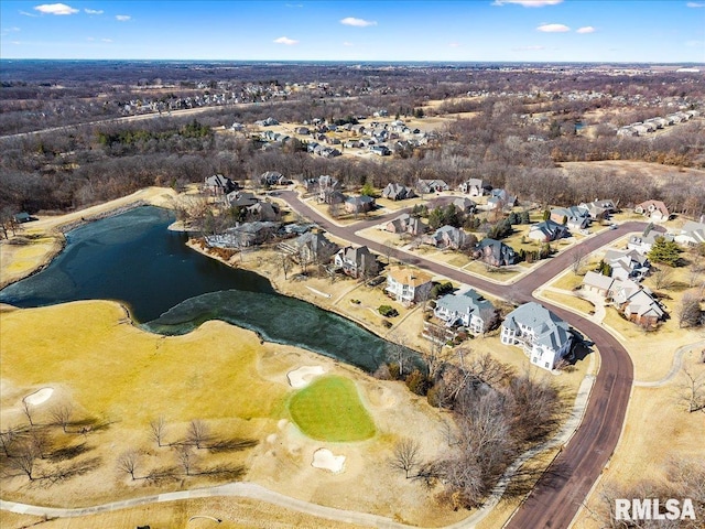 drone / aerial view with a water view and a residential view