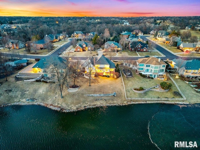 bird's eye view featuring a residential view and a water view