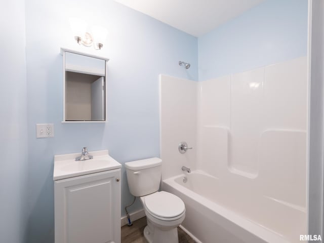 full bath with toilet, washtub / shower combination, baseboards, and vanity