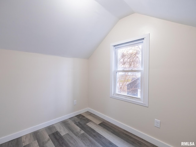 bonus room featuring vaulted ceiling, baseboards, and wood finished floors