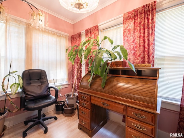 office space with light wood-style floors, a chandelier, and crown molding