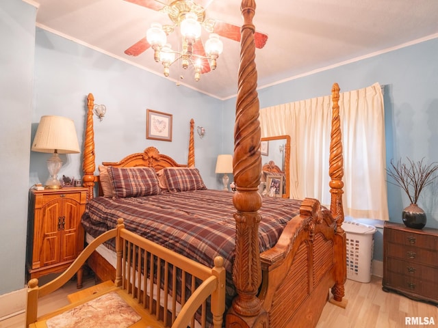 bedroom featuring wood finished floors and crown molding