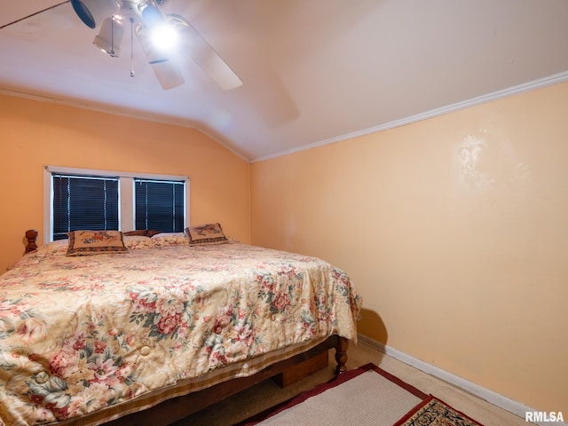 carpeted bedroom featuring vaulted ceiling, baseboards, and crown molding