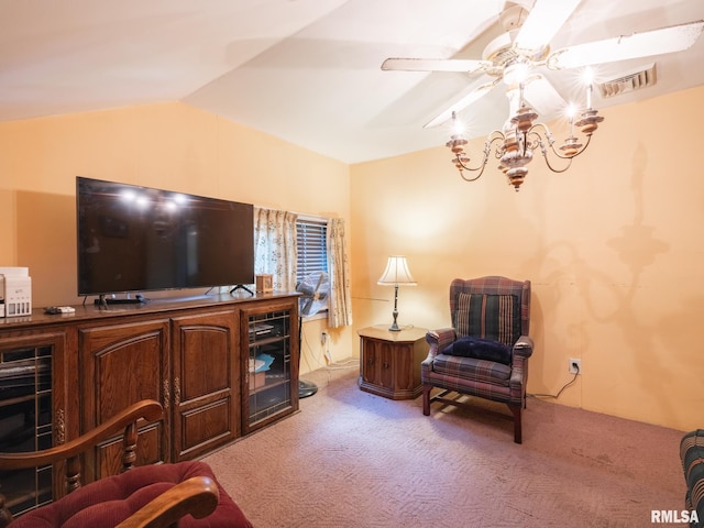 living area featuring carpet floors, visible vents, vaulted ceiling, and a ceiling fan