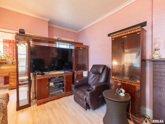 living area featuring ornamental molding and wood finished floors