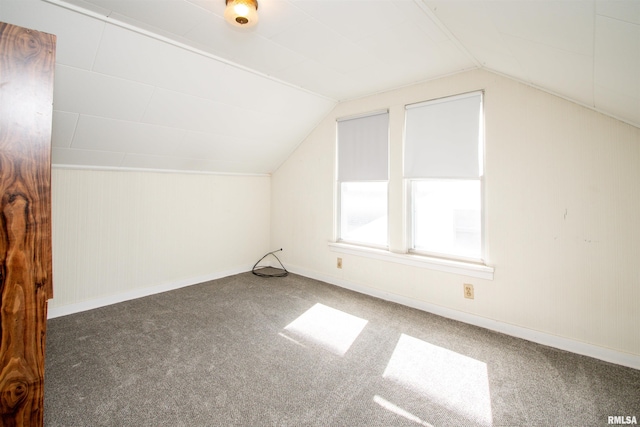 bonus room with carpet floors, vaulted ceiling, and baseboards