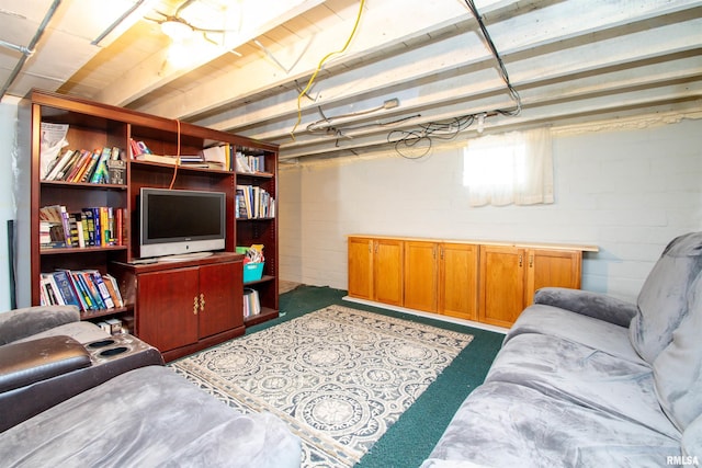 living room with concrete block wall