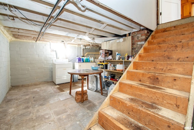 unfinished basement with washing machine and dryer