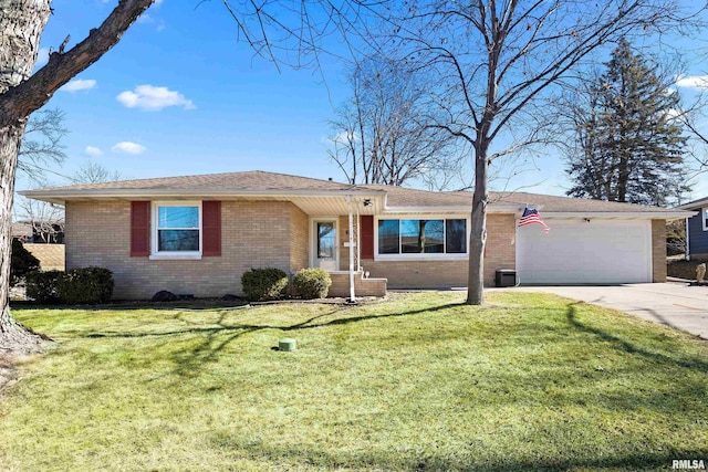 ranch-style house featuring a front yard, concrete driveway, brick siding, and an attached garage