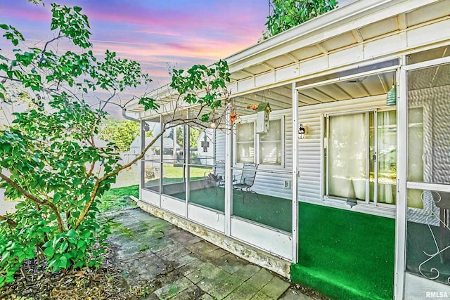 view of patio terrace at dusk