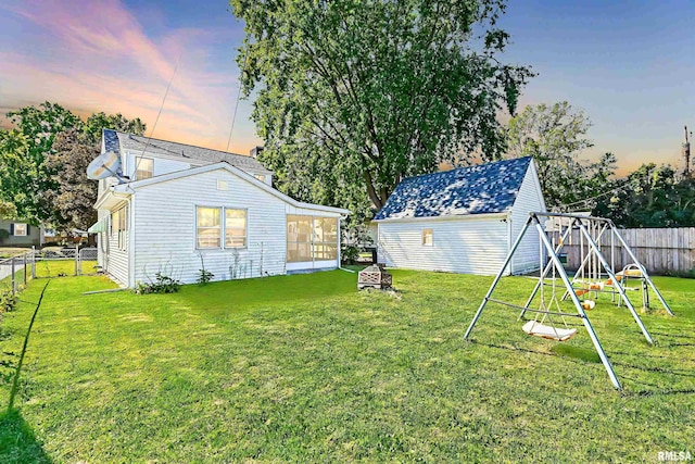 view of yard with a fenced backyard and a playground