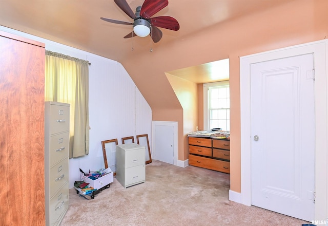 additional living space featuring lofted ceiling, carpet floors, and a ceiling fan