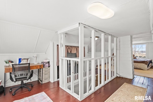 office area featuring vaulted ceiling and wood finished floors