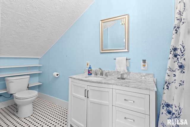 full bathroom featuring baseboards, toilet, a shower with shower curtain, lofted ceiling, and vanity