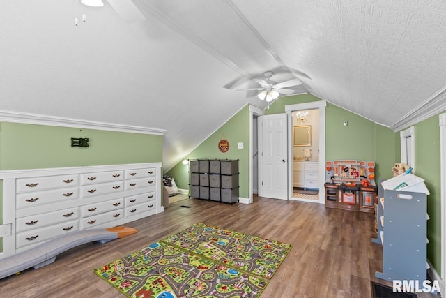 game room featuring ceiling fan, a textured ceiling, lofted ceiling, and wood finished floors