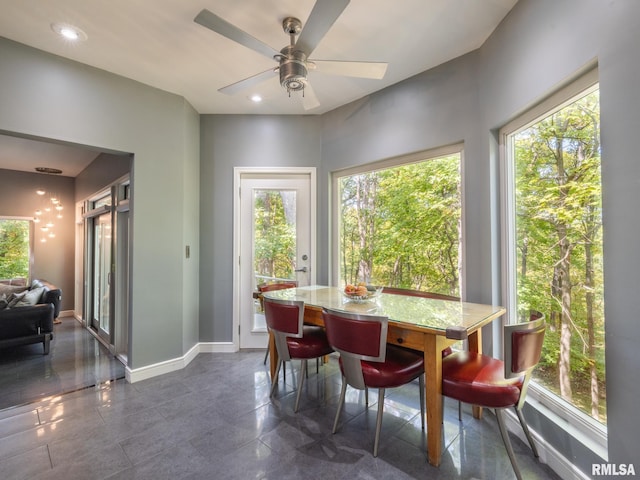 dining room with a wealth of natural light, baseboards, and recessed lighting