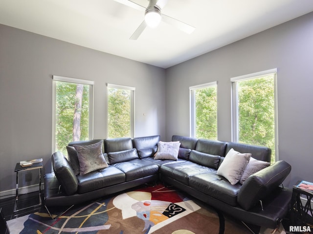 living area with plenty of natural light and ceiling fan