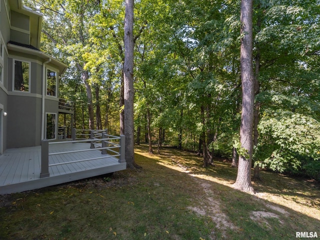 view of yard with a wooden deck