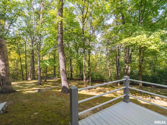 wooden deck with a view of trees