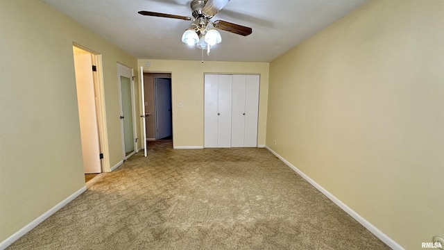 unfurnished bedroom featuring carpet floors, ceiling fan, and baseboards