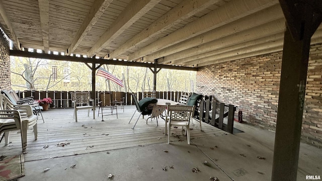 wooden terrace featuring outdoor dining area