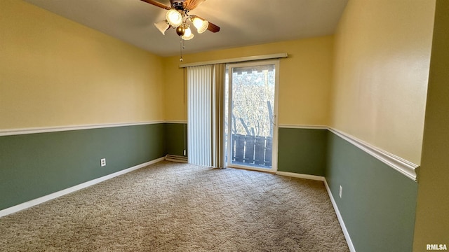 unfurnished room featuring carpet floors, baseboards, and a ceiling fan