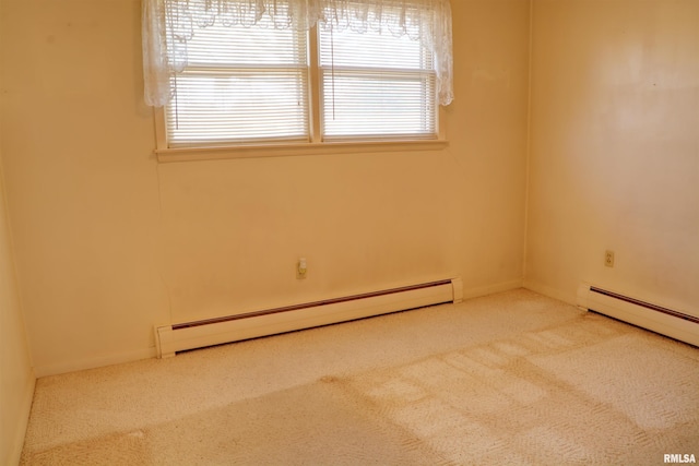 empty room with carpet, a baseboard heating unit, and baseboard heating