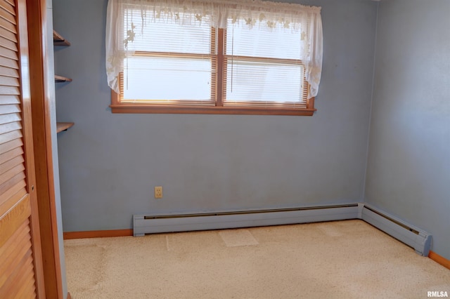 unfurnished room with baseboards, baseboard heating, and a healthy amount of sunlight