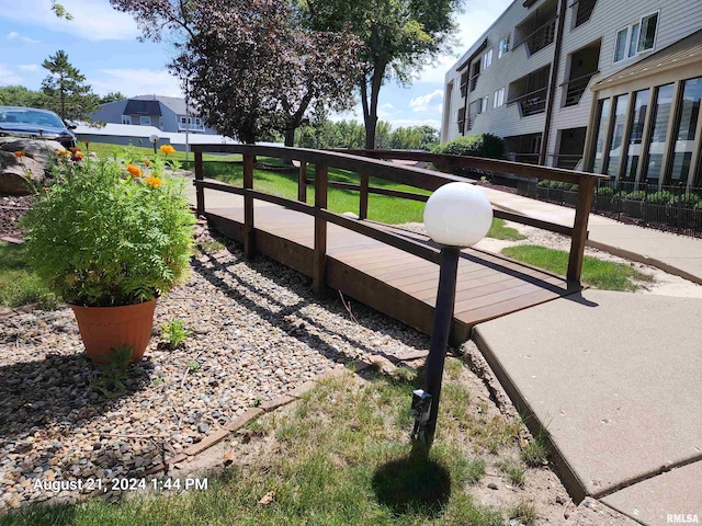 view of community with fence