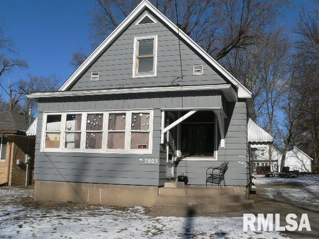 view of snow covered house