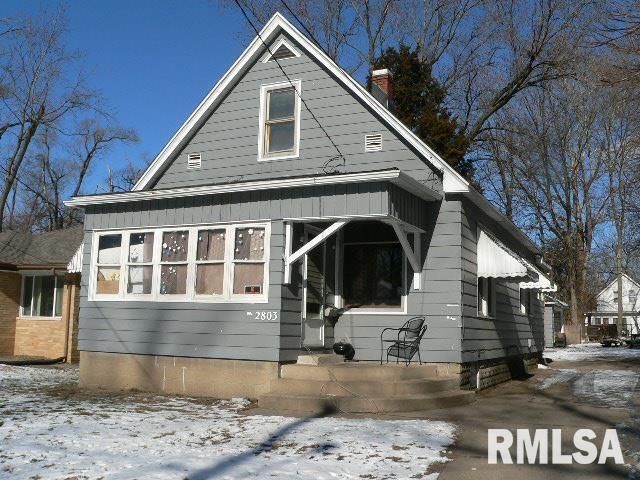 view of front of property with a chimney