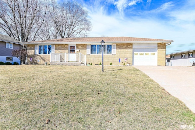 single story home featuring a garage, driveway, brick siding, and a front lawn