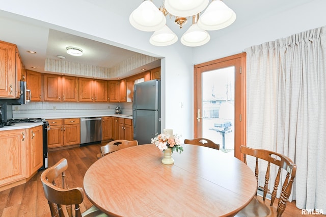 dining room featuring recessed lighting and dark wood-style floors