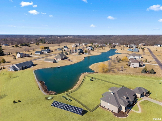 birds eye view of property featuring a water view and a residential view