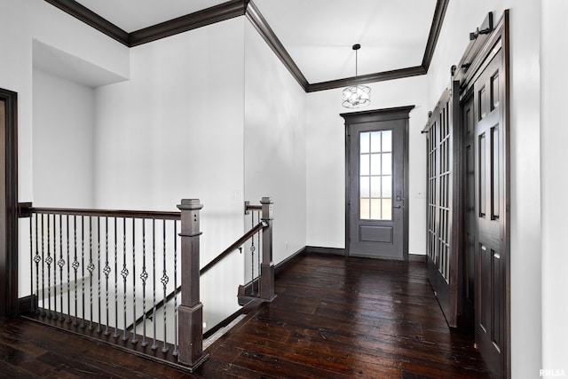 interior space featuring baseboards, crown molding, and hardwood / wood-style floors