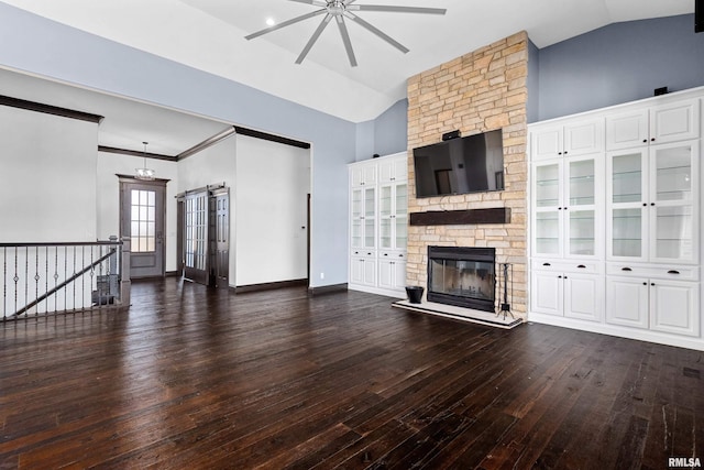 unfurnished living room with wood-type flooring, lofted ceiling, and ceiling fan