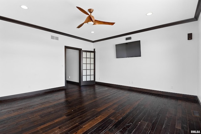 spare room with baseboards, visible vents, a ceiling fan, hardwood / wood-style floors, and ornamental molding