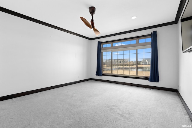 carpeted spare room with a ceiling fan, baseboards, ornamental molding, and recessed lighting