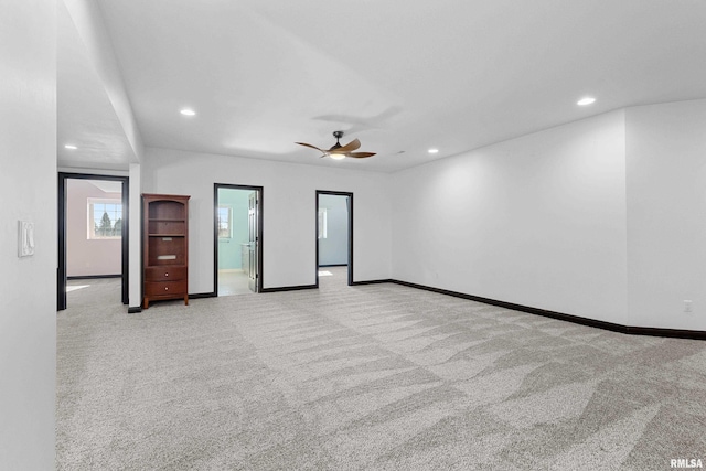 spare room featuring recessed lighting, baseboards, a ceiling fan, and light colored carpet