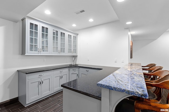 bar with recessed lighting and wood tiled floor