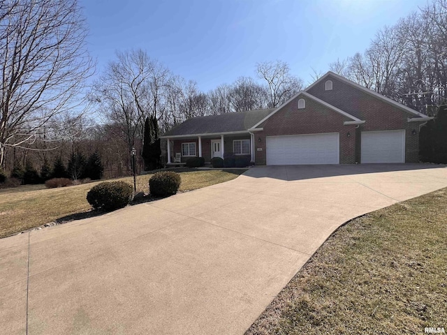 ranch-style house with a garage, driveway, a front lawn, and brick siding