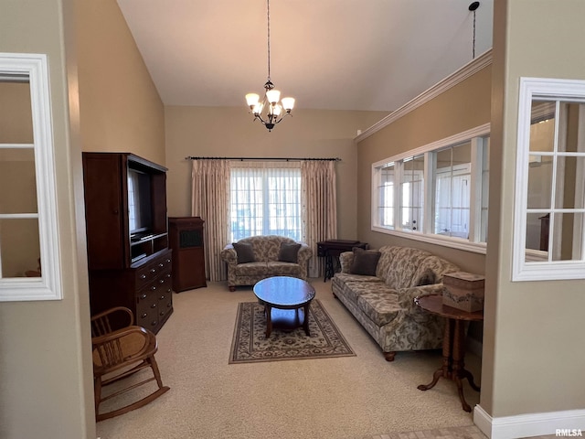 carpeted living area with a healthy amount of sunlight, a chandelier, and vaulted ceiling